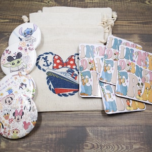 May include: A set of eight round, colourful, Disney-themed coasters featuring various characters, including Stitch, Baby Yoda, Mickey Mouse, and Minnie Mouse. The coasters are packaged in a white canvas bag with a blue and white design featuring a ship and a red bow.