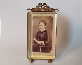 Vintage old Napoleon III photo frame/thick glass/brass structure/knot on the pediment/ball base/to place or hang/photograph of a young girl