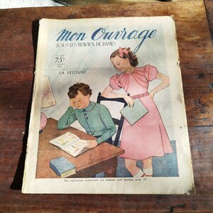 May include: A vintage magazine cover featuring a young girl in a pink dress and a boy in a green sweater. The magazine is titled "Mon Ouvrage" and features the text "Tous les travaux de dames" and "La Lecture".