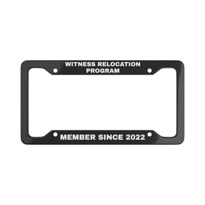 May include: Black plastic license plate frame with white text that reads "Witness Relocation Program" and "Member Since 2022".