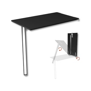 Puede incluir: Mesa plegable de pared negra con una superficie rectangular y dos patas de soporte plateadas. La mesa se pliega contra la pared, con un diagrama que muestra el mecanismo de plegado. La mesa está diseñada para ahorrar espacio.
