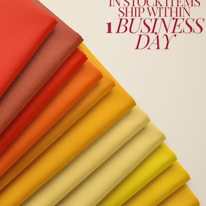 May include: A fan of colorful fabric swatches in shades of red, orange, and yellow. The fabric is arranged in a diagonal pattern, showcasing a gradient of colors. The image includes text that reads "IN STOCK ITEMS SHIP WITHIN 1 BUSINESS DAY."