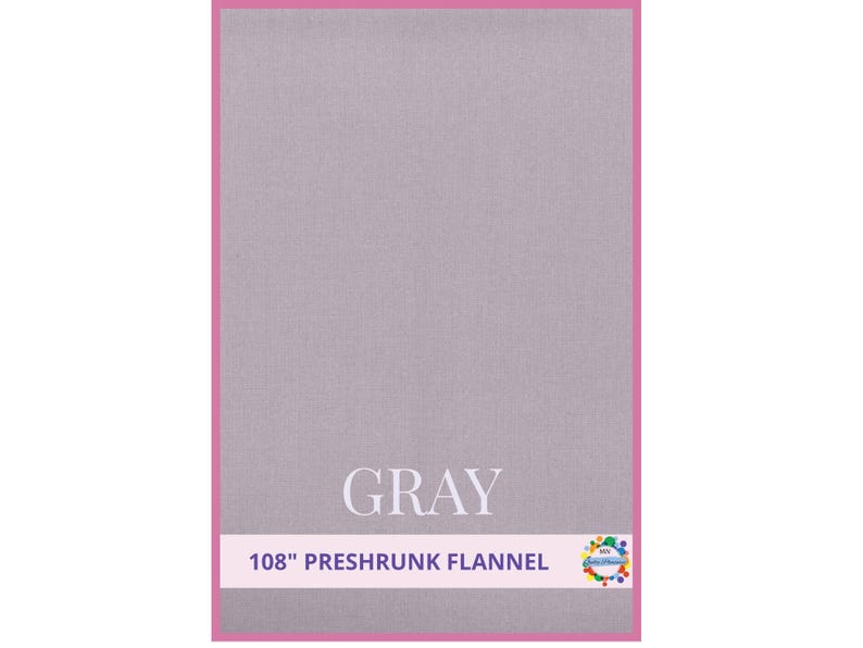 May include: A gray preshrunk flannel fabric with a pink border. The word "GRAY" is displayed in white, with the text "108" PRESHRUNK FLANNEL" below it. The fabric is 108 inches wide.
