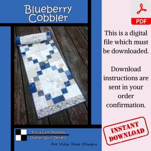 May include: A digital download pattern for a blueberry cobbler quilt table runner. The table runner is made with a patchwork of blue, white and grey squares. The pattern is available for instant download.