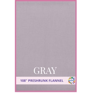 May include: A gray preshrunk flannel fabric with a pink border. The word "GRAY" is displayed in white, centered on the fabric. The text "108" PRESHRUNK FLANNEL" is below the word "GRAY".