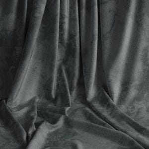 May include: A gray fabric backdrop with soft folds and wrinkles. The fabric has a slightly textured surface.