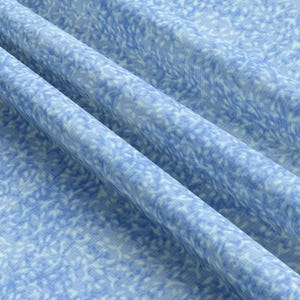 May include: A close-up of a light blue fabric with a white and light blue patterned design. The fabric is soft and has a subtle sheen.
