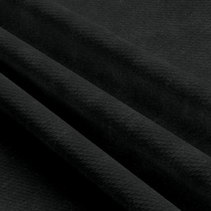 May include: Close-up of a black fabric with a textured surface. The fabric has a subtle sheen and a soft, velvety feel.