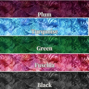 May include: Five fabric swatches with a paisley pattern. The swatches are in the colors plum, turquoise, green, fuchsia, and black.