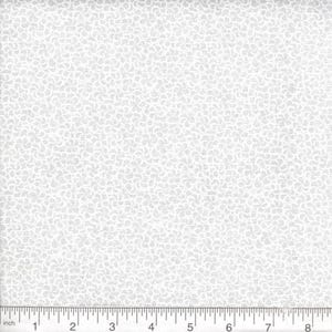 May include: A white fabric featuring a repeating pattern of small, light gray curved shapes. A ruler is positioned along the bottom edge, showing a scale in inches that spans from zero to eight inches, providing a clear sense of the scale of the print.