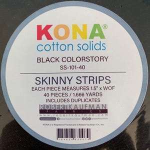 May include: A circular label with the text "KONA cotton solids" in red, yellow, and green. The label also states "BLACK COLORSTORY" and "SKINNY STRIPS". The label includes the Robert Kaufman Fabrics logo and product details.