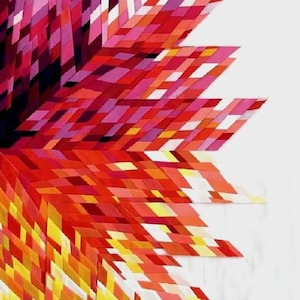 May include: A geometric wall art piece composed of numerous small, rectangular fabric or paper strips arranged in a starburst pattern. The composition features a vibrant gradient of colors, transitioning from deep purple and magenta to bright red, orange, and yellow.