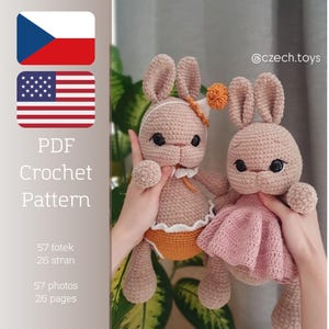 May include: Two crocheted bunny dolls in light brown with black eyes and long ears. One bunny wears a pink dress, the other an orange outfit. The image includes text: PDF Crochet Pattern, 57 photos, 26 pages, and the @czech.toys logo.