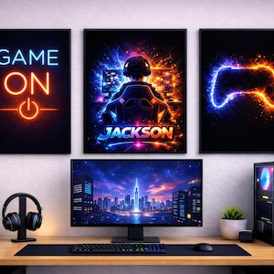 May include: A gaming setup with three framed neon art prints on a wall. The prints show the words "GAME ON", a gamer with the name "JACKSON", and a game controller. A computer monitor, keyboard, mouse, and PC tower are also visible.