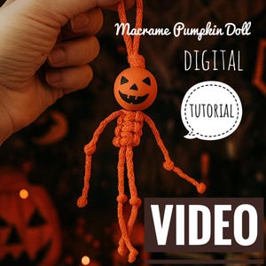 May include: An orange macrame pumpkin doll with a carved face, held up against a blurred background. The doll has a round head and a body made of knotted rope. Text on the image reads "Macrame Pumpkin Doll DIGITAL TUTORIAL VIDEO".