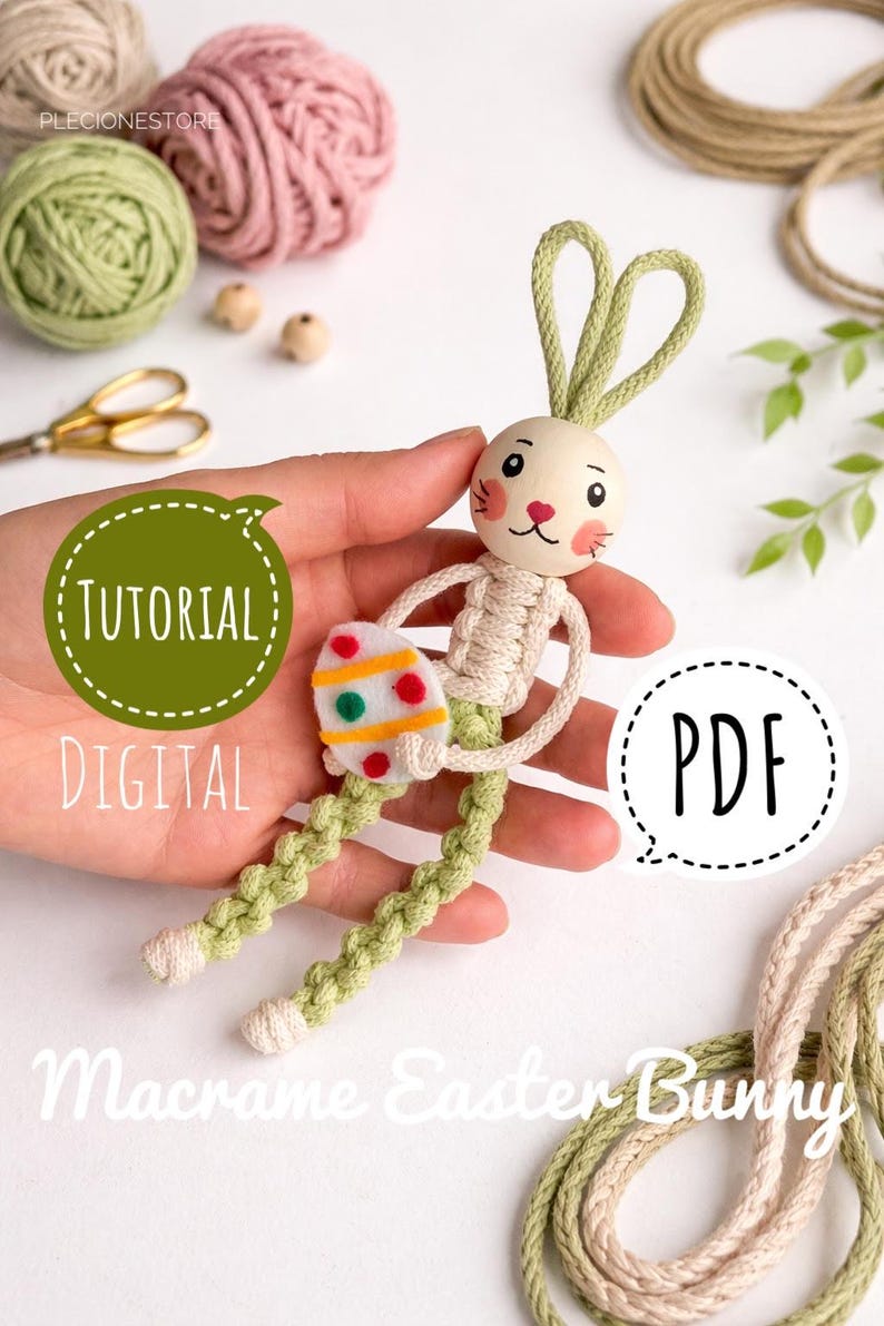 May include: A macrame Easter bunny, featuring a wooden head and a decorated egg. The bunny has green braided legs and ears. The image includes the text "Tutorial Digital PDF" and "Macrame Easter Bunny".