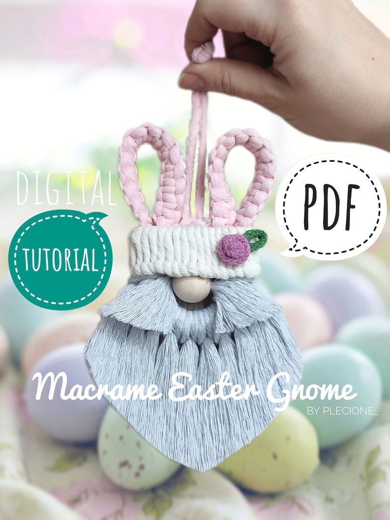 May include: A digital PDF tutorial for making a macrame Easter gnome with pink bunny ears, a white crocheted hat, a wooden bead nose, and a light blue beard. The gnome is sitting on a bed of pastel coloured Easter eggs.