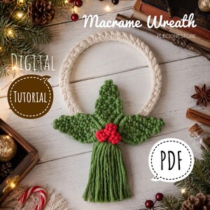 May include: A macrame wreath featuring a circular off-white cord frame with a green knotted holly leaf design and three red berries in the centre. The text reads Macrame Wreath, DIGITAL TUTORIAL, and PDF. The design includes a green fringe tassel.