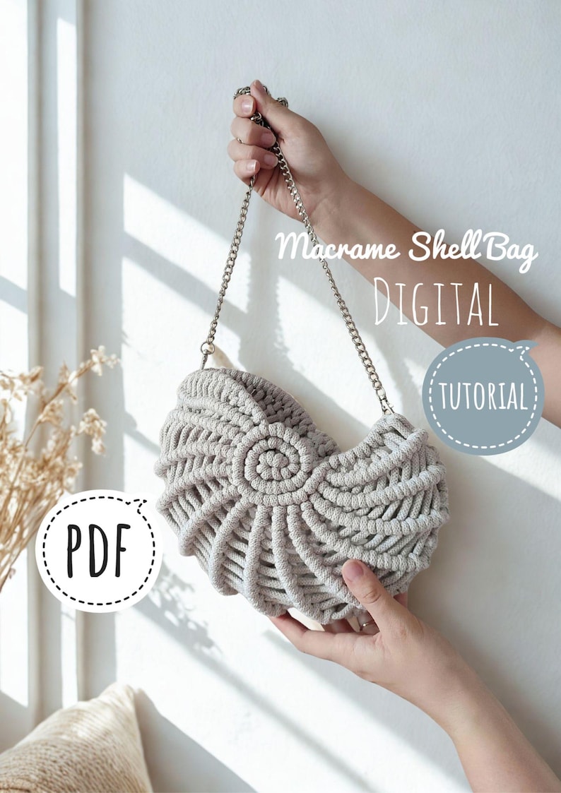 May include: A light gray macrame shell bag with a silver chain strap. The bag is held by a person's hands. Text on the image reads "Macrame Shell Bag DIGITAL TUTORIAL PDF". The bag has a spiral design in the center.
