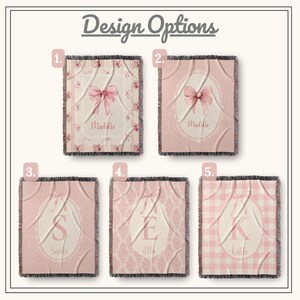 May include: Five personalised throw blanket design options. Each blanket features a pink bow or initial design. The blankets are in shades of pink and white, with fringe edges. The text "Design Options" is at the top.