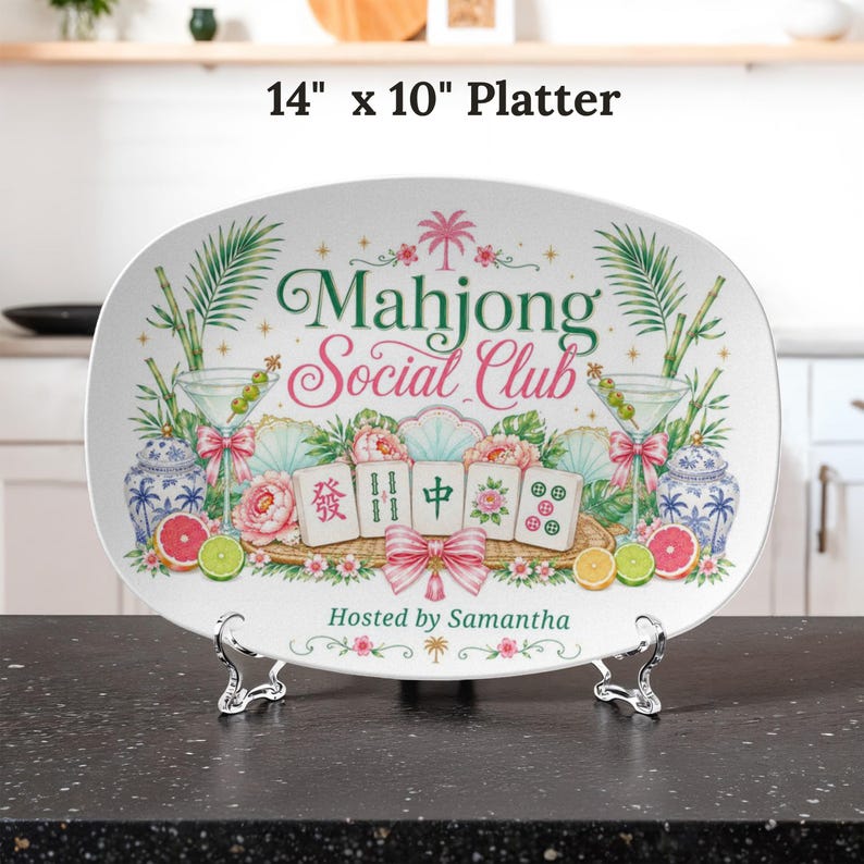 May include: An oval platter, 14" x 10", with a floral and tropical design. The platter features the text "Mahjong Social Club" and "Hosted by Samantha". Decorative elements include martini glasses, flowers, and fruit.