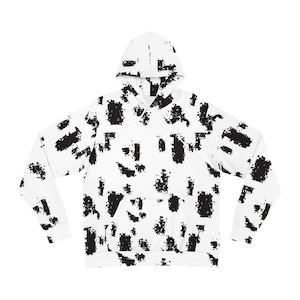 May include: White hoodie with a black pixelated design. The hooded sweatshirt features a front pocket and a drawstring hood. The pattern covers the entire garment, including the hood and sleeves. A casual, comfortable style.