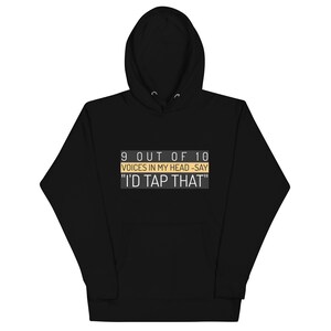 May include: Black hooded sweatshirt with a white and yellow graphic print that says "9 out of 10 voices in my head - say "I'd tap that""