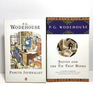 May include: Two vintage books by P.G. Wodehouse are displayed. The book on the left is titled "Psmith Journalist" with an illustration of a man at a desk. The book on the right is "Jeeves and The Tie That Binds".