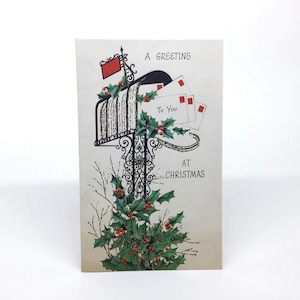 jaren 1950 gebruikte Hawthorne-Sommerfield Glitter kerstwenskaart - kerstkaarten in brievenbus met hulst, een groet aan u met Kerstmis