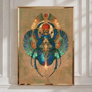 May include: A framed wall art print featuring a central blue and green scarab beetle with expansive, detailed wings. The beetle is adorned with a large red circular gem at the top and intricate gold filigree patterns against a tan background.