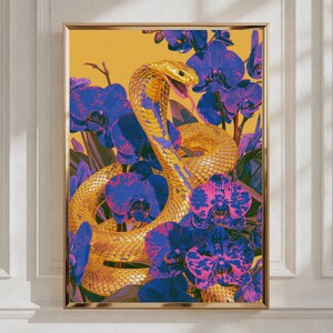 May include: A vertical rectangular wall art print featuring a golden cobra snake coiled amidst vibrant blue and purple orchid flowers. The snake is positioned centrally with its head raised against a solid mustard yellow background.