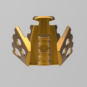 May include: A gold-colored metal mask with a geometric design. The mask has a central section with a series of raised rings and two side sections with a series of holes.