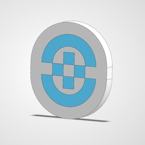 May include: A 3D-rendered, circular emblem with a gray outer ring and a light blue geometric design in the center. The design features a stylized letter or symbol, with a shadow cast below.