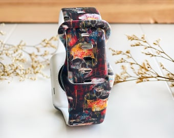 Può includere: Un cinturino per orologio colorato con un design a teschio e ossa incrociate. Il cinturino è realizzato in silicone e presenta una gamma di colori vivaci e brillanti.