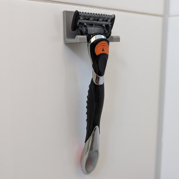 Razor holder for gluing (e.g. on tiles / panes in shower stalls) - suitable for all common wet razors