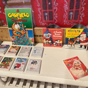 Miniature Christmas General Store, Dollhouse Signs, Firewood, Pinecones, Greenery, Cards, Candy Canes, DVD's Books, Albums, Santa, Art, 1:12 image 8