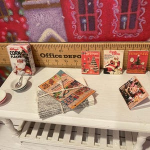 Miniature Christmas General Store, Dollhouse Signs, Firewood, Pinecones, Greenery, Cards, Candy Canes, DVD's Books, Albums, Santa, Art, 1:12 image 12