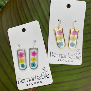 Handmade pink, yellow, and blue Real Pressed Flower Earrings. 14K White and Yellow Gold plated. Pride Earrings.