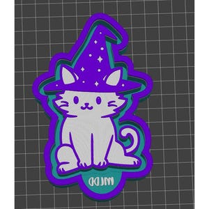 May include: A white cat wearing a purple and blue witch hat with stars. The cat is sitting with its tail curled around its legs. The image is a 3D model of a cookie cutter.