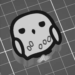 May include: A white owl with black eyes and a black outline. The owl has a small beak and a round body. The owl is sitting on a gray surface.