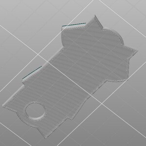 May include: A gray 3D printed pendant with a circular cutout in the center and a unique, geometric shape.