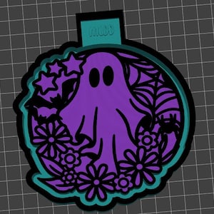 May include: Purple ghost with black eyes surrounded by black floral and star designs on a teal background. "Halloweeen" is written on the top of the design.