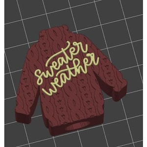 May include: A red knitted sweater with the text "sweater weather" in yellow lettering.