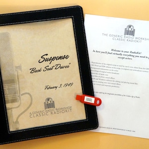 May include: A black leather folder with a brown paper insert. The insert has a vintage microphone image and the text "Suspense "Back Seat Driver" February 3, 1949". The folder has the text "A Generic Radio Workshop Classic Radiokit" printed on the bottom. A red USB drive with the text "Radiokit" is attached to the folder.