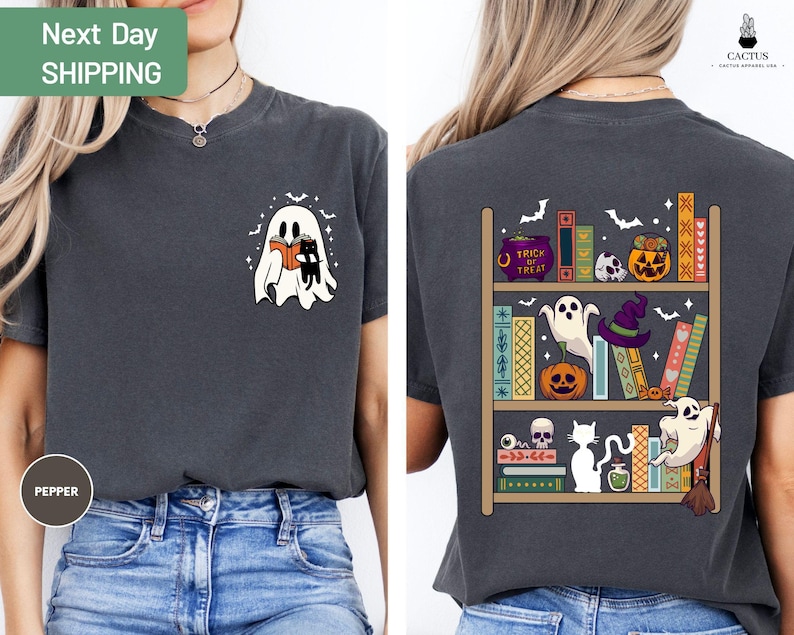 a woman wearing a t - shirt with a ghost on it