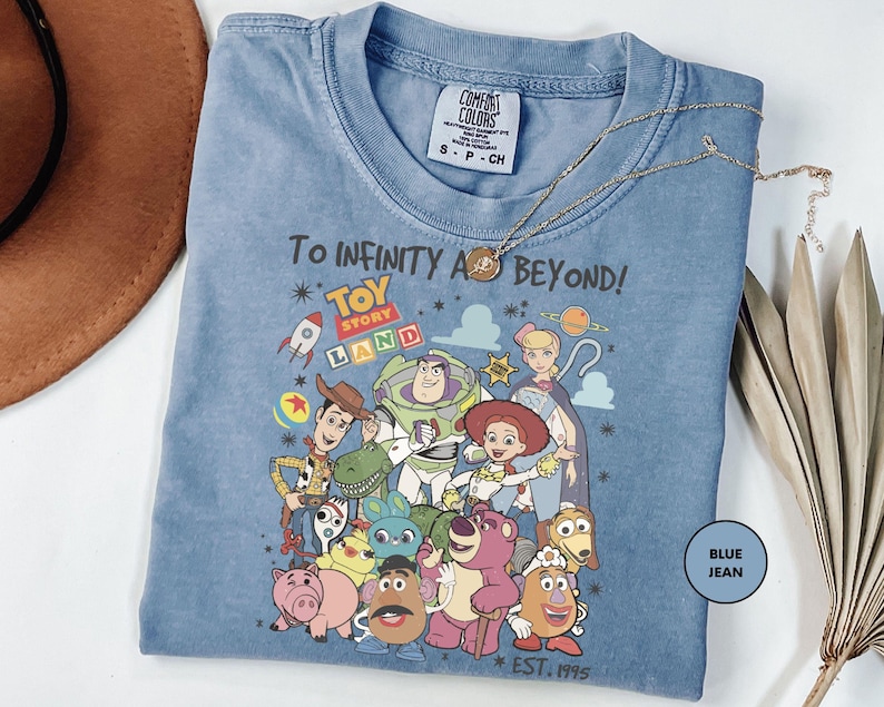 a blue tshirt with cartoon characters on it