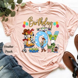 a pink birthday shirt with a cartoon character on it