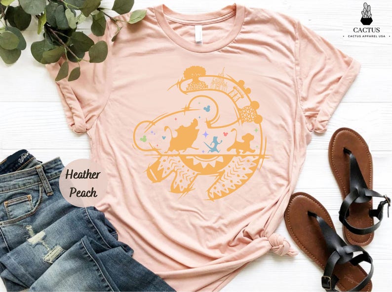 a pink t - shirt with an image of a fish on it