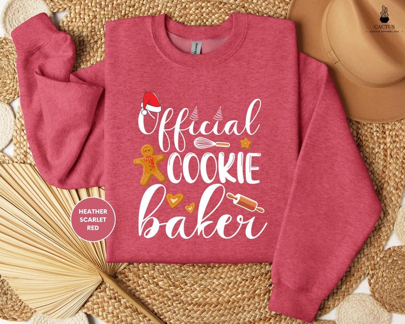 a red shirt that says official cookie baker