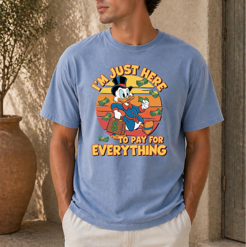 a t - shirt that says i'm just here to pay for everything